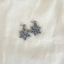 Load image into Gallery viewer, Paper quilled Snowflake earrings in black with silver edge color.
