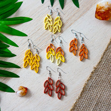 Load image into Gallery viewer, Fall / autumn colors inspired drop earrings in fish hook style. Colors include rust, pumpkin, deep yellow, pale yellow and a multi-color one with pumpkin, deep yellow and pale yellow together.
