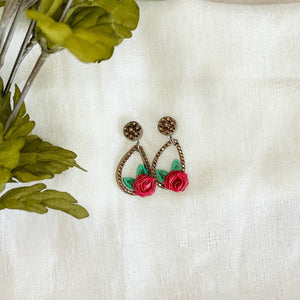 Handmade earrings with paper quilled rose, leaves and rhinestones in a stud plus teardrop shape.