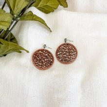 Load image into Gallery viewer, Handmade lightweight paper quilled earrings in solid color circle shape with beehive like pattern in the middle. Copper Color with ear studs.
