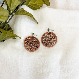 Handmade lightweight paper quilled earrings in solid color circle shape with beehive like pattern in the middle. Copper Color with ear studs.
