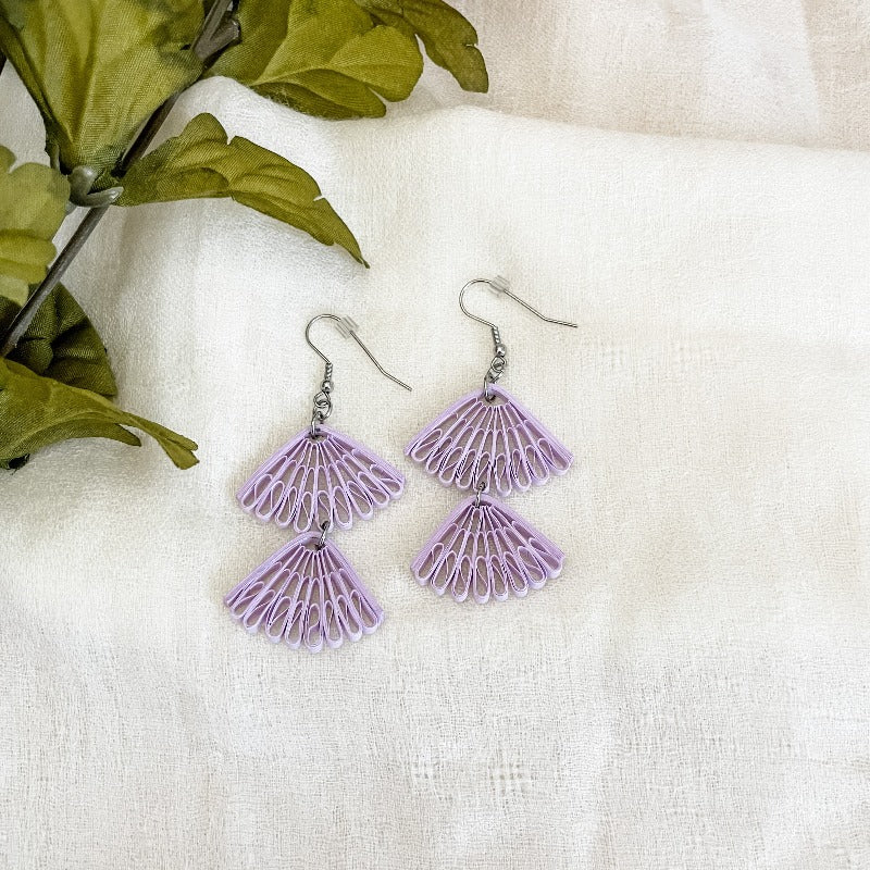 Handmade paper quilled earrings in seashells shape and lilac color