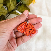 Load image into Gallery viewer, Handmade paper quilled lightweight earrings inspired by California Poppy flower. This is a deconstructed form. It has 3 orange petals hanging together.
